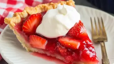 Freshly made Big Boy’s Fresh Strawberry Pie filled with vibrant strawberries and topped with glossy glaze in a golden flaky crust — perfect summer dessert.